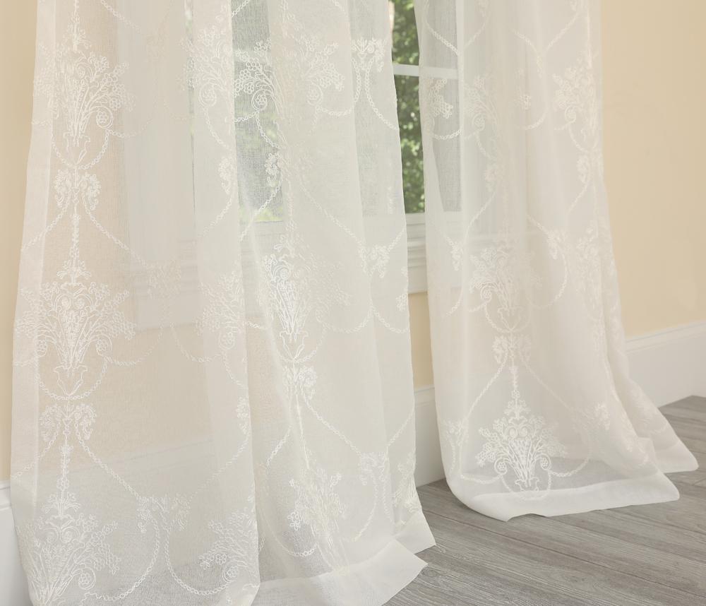 ML19007 Lillie Sheer Curtain featuring an intricate heart-shaped embroidered pattern in lightweight sheer fabric, available in White and Gold.